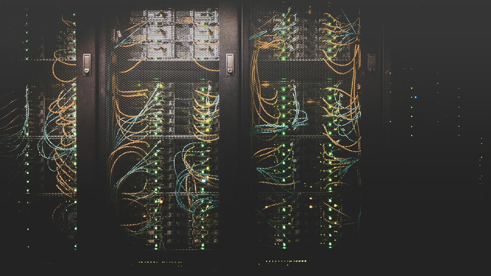 Rows of blue-lit server racks inside a modern data center