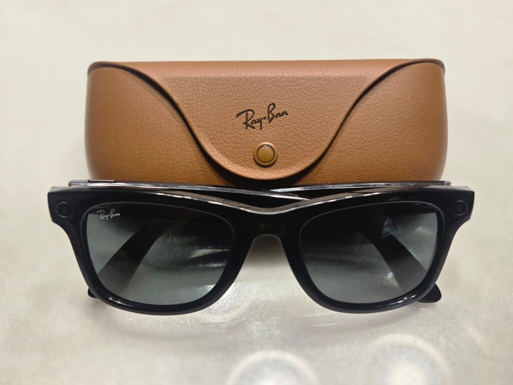 Ray-Ban Meta smart glasses with charging case on a light surface