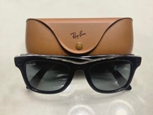 Ray-Ban Meta smart glasses with charging case on a light surface