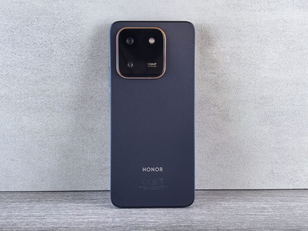 Rear view of a black Honor smartphone showing its square camera module