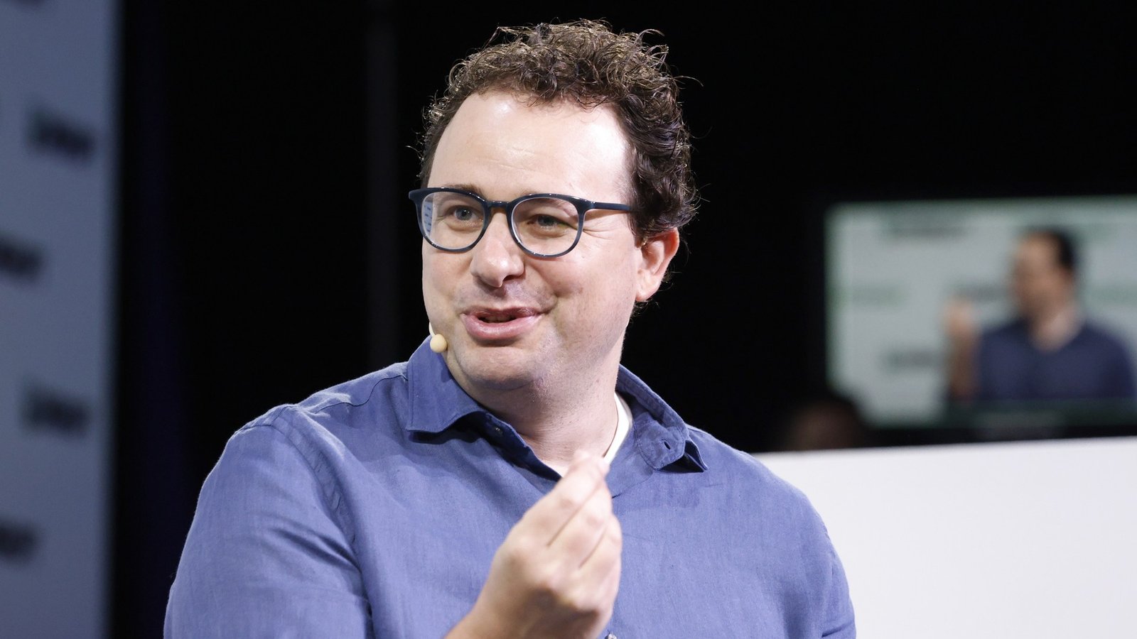 Anthropic CEO Dario Amodei speaking on stage at TechCrunch Disrupt 2023