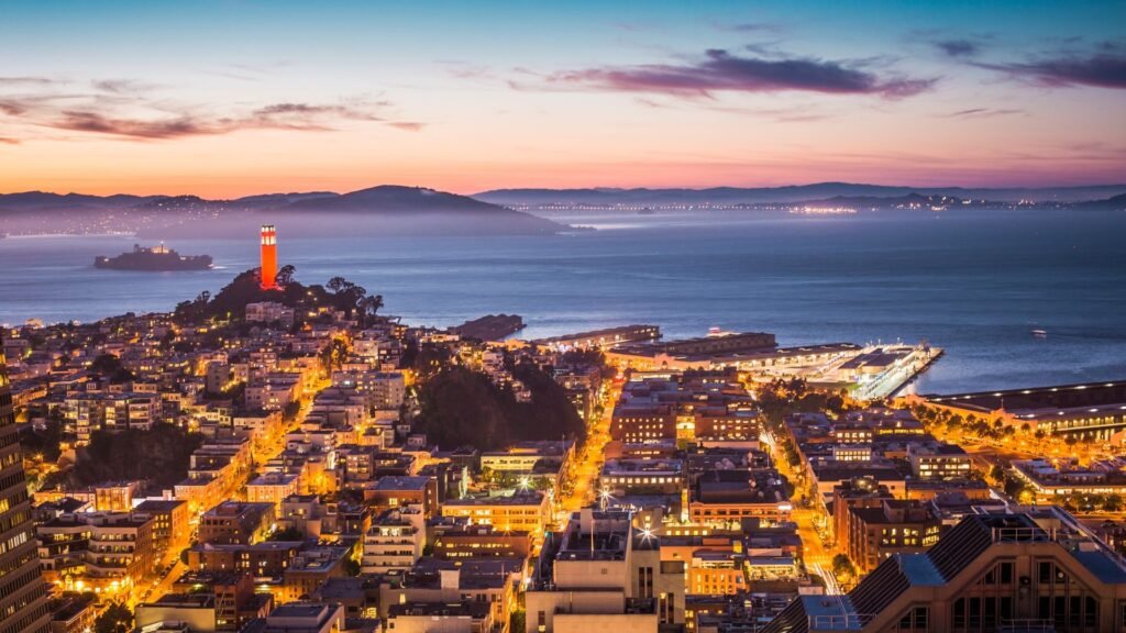San Francisco skyline and bay glowing at dusk