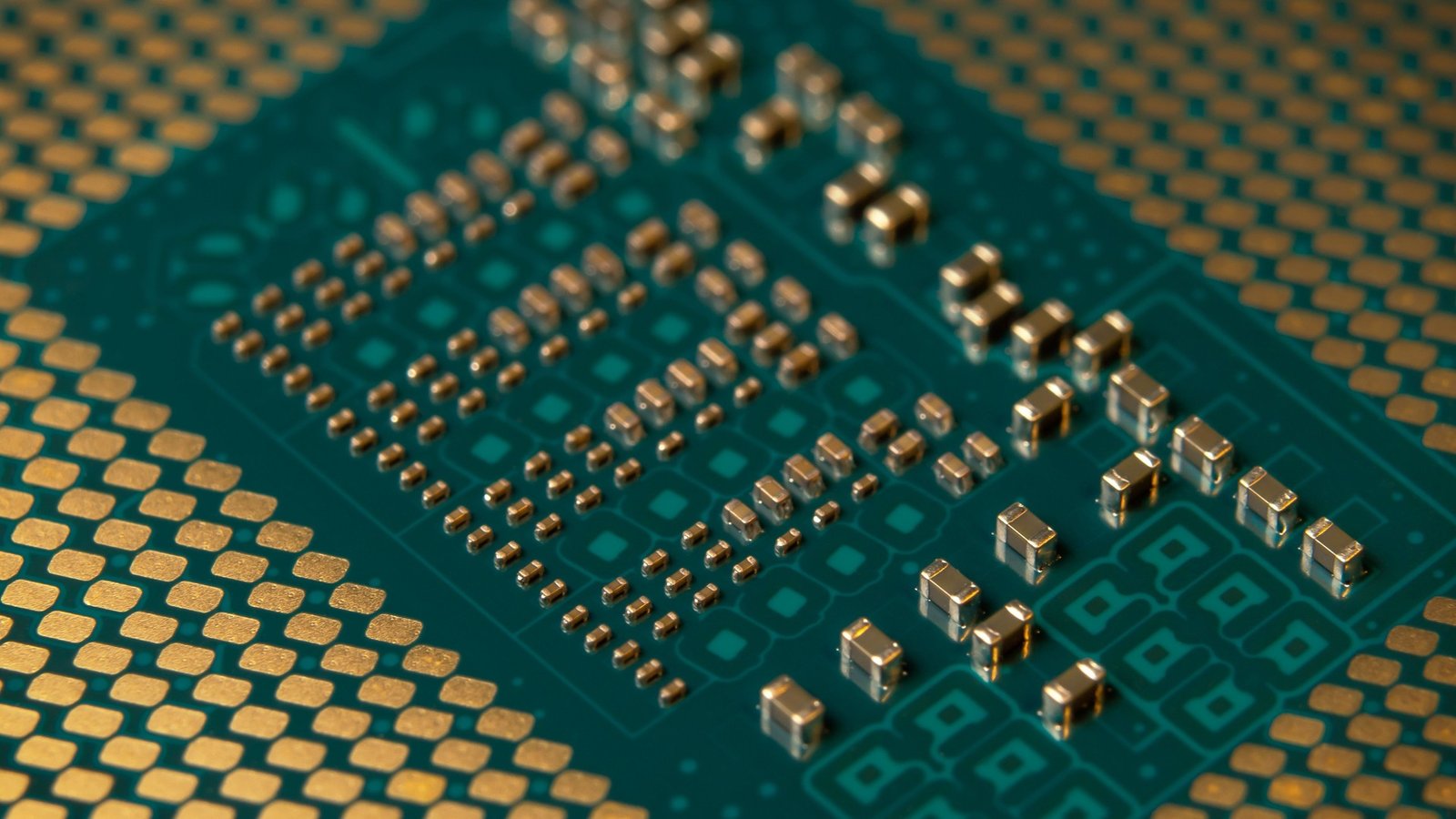 Extreme macro photograph of a microprocessor's gold contact pins and circuitry