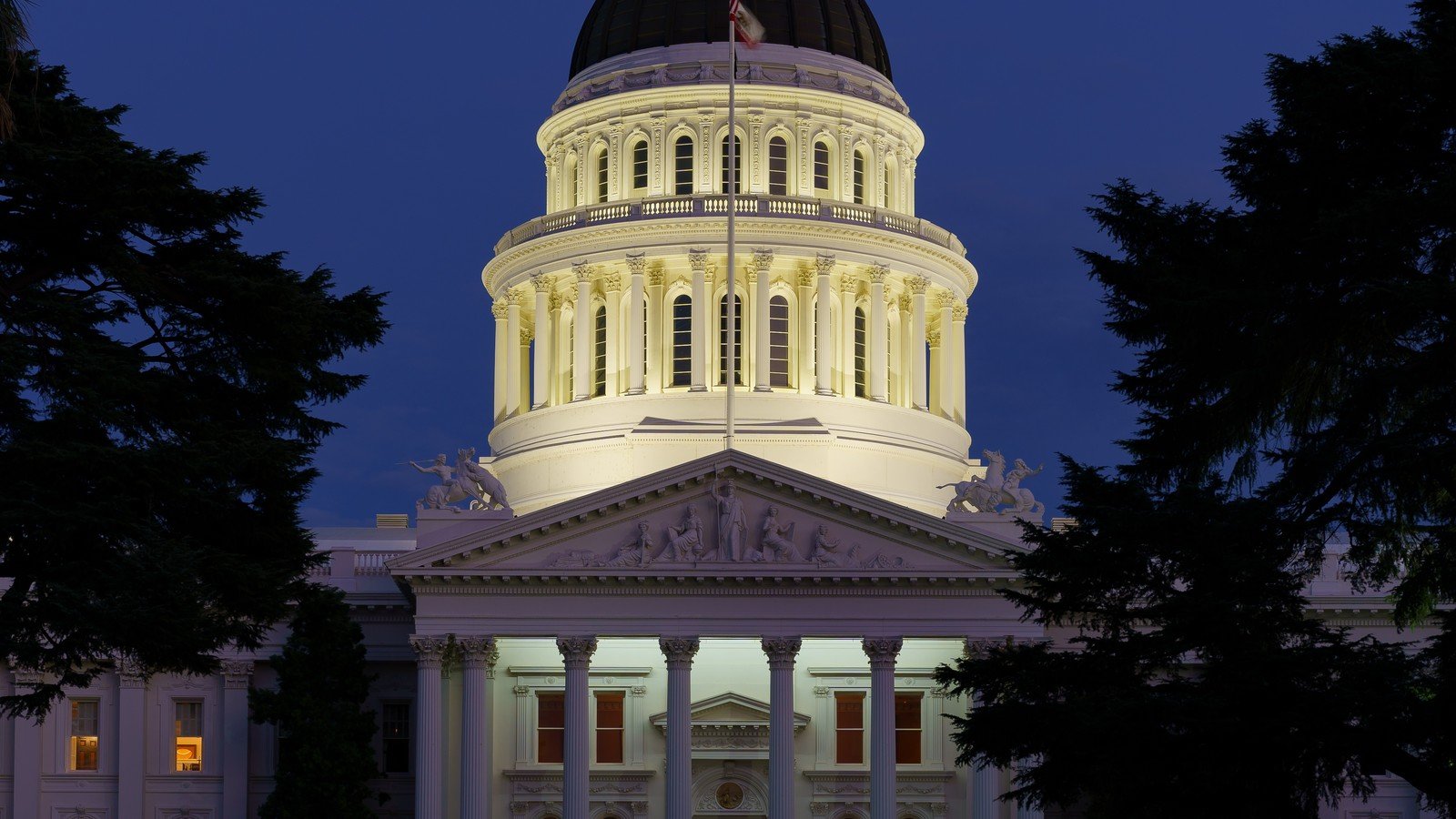 The California State Capitol dome illuminated at blue hour in Sacramento