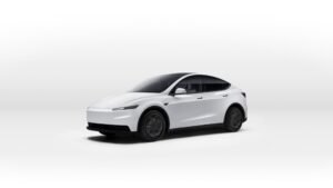 A white Tesla Model Y in a studio setting