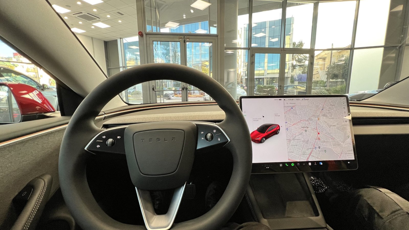 Tesla Model 3 interior with the large center touchscreen switched on
