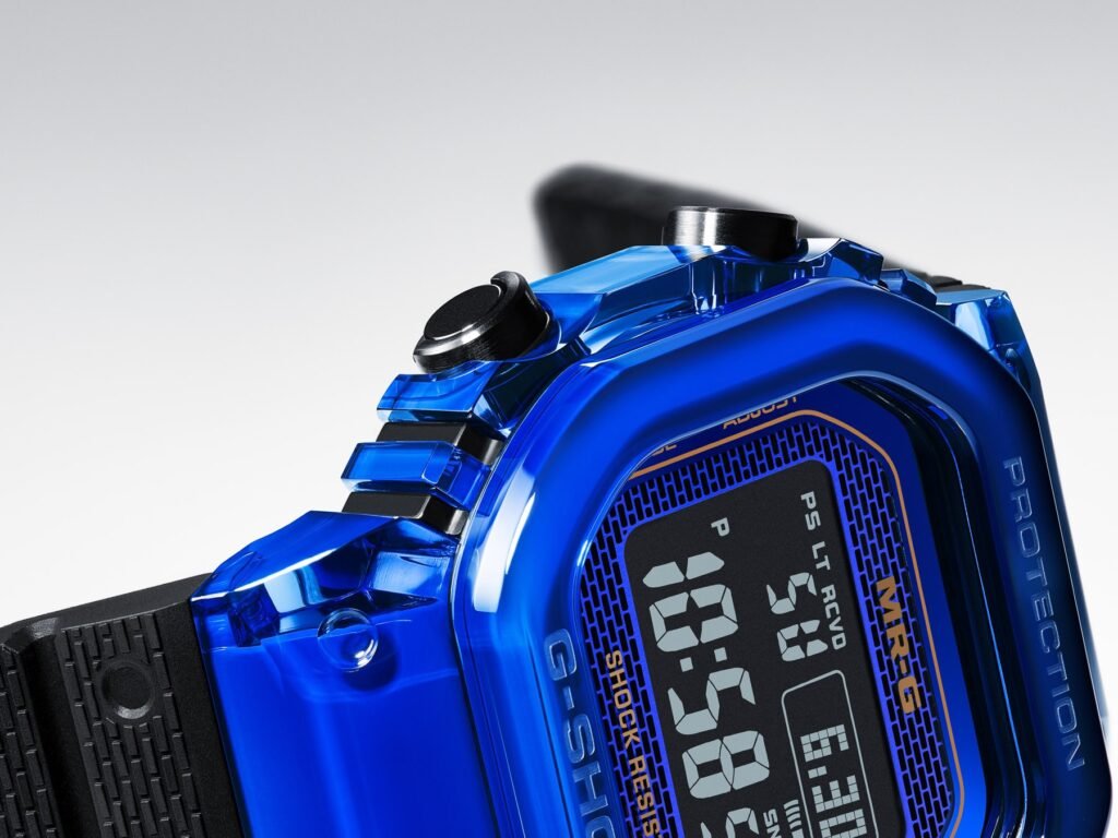 Extreme macro of the blue sapphire crystal bezel, gold lettering and digital display of the Casio G-Shock MRG-D5000