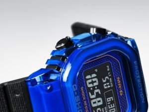 Extreme macro of the blue sapphire crystal bezel, gold lettering and digital display of the Casio G-Shock MRG-D5000