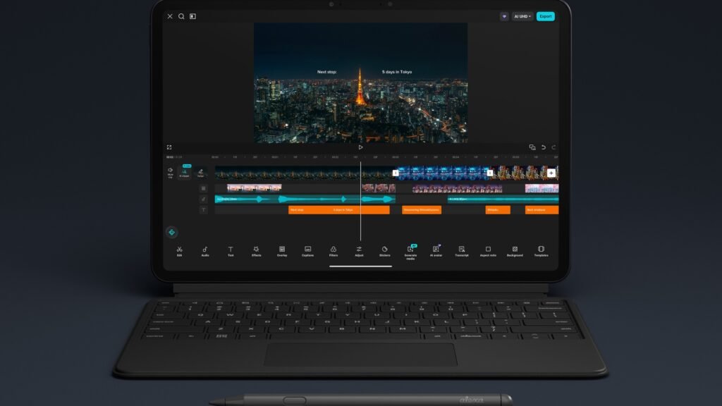 The Amazon Alexa Tablet 12 Pro with the Pro Keyboard attached and Pro Pen lying below, displaying a video-editing app with a Tokyo night skyline