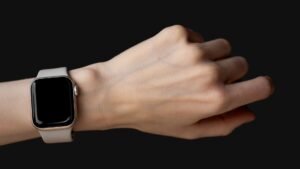 Smartwatch on a wrist against a black background