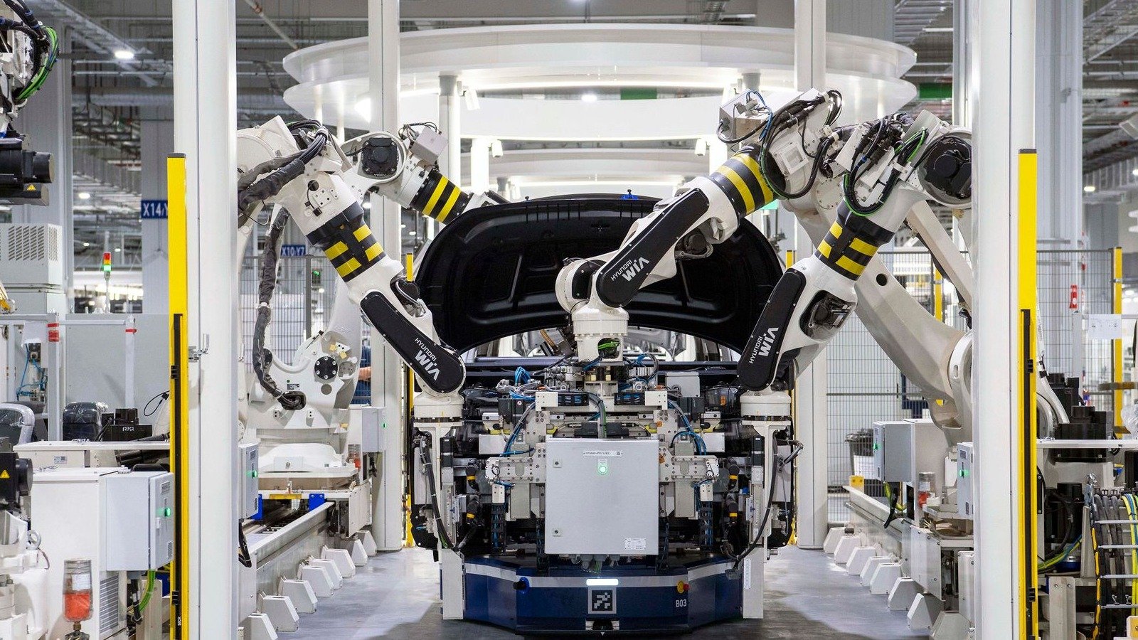 Hyundai WIA robot arms assembling a car body on an automated factory line