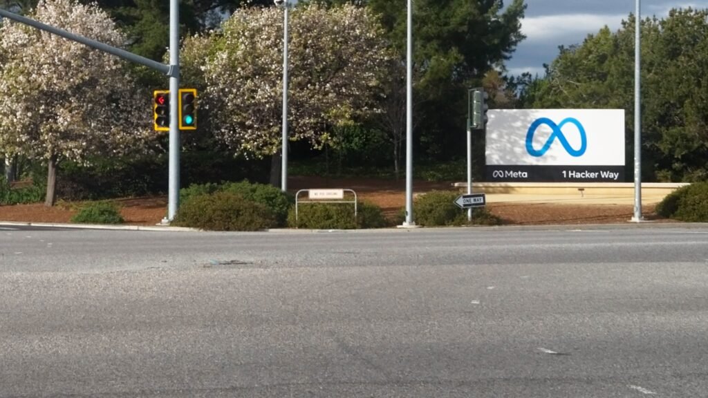 Meta infinity logo sign at the company's Menlo Park headquarters entrance