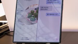 Unfolded Samsung Galaxy Z Fold 8 on a display table with its big screen lit