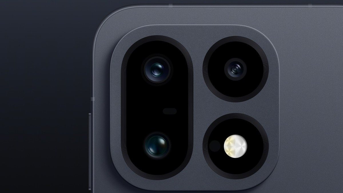 Close-up of the OnePlus 16's triple camera module on a dark background