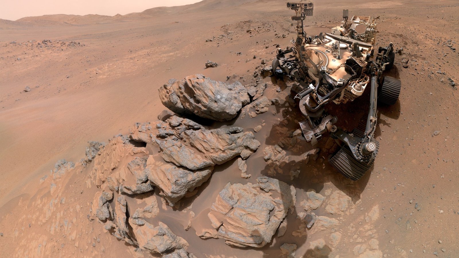 NASA's Perseverance rover takes a selfie at Lac de Charmes on Mars, with the Jezero Crater rim behind it