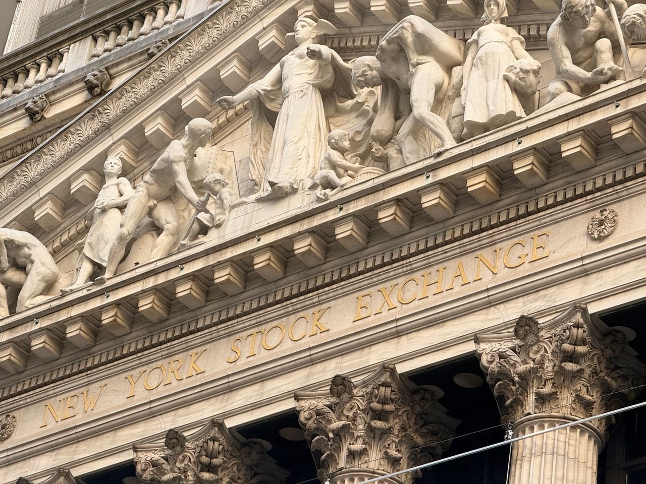New York Stock Exchange facade with stone sculptures above the entrance