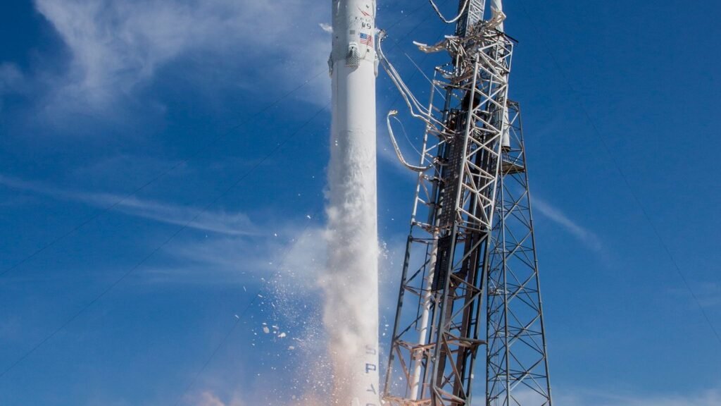 A SpaceX Falcon 9 rocket lifting off from its launch pad