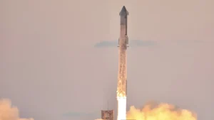 SpaceX Starship lifting off from Starbase in a huge plume of fire and smoke
