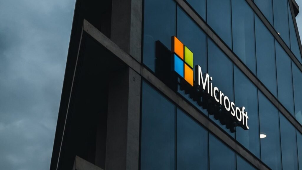 Microsoft office building at dusk with the illuminated Microsoft logo