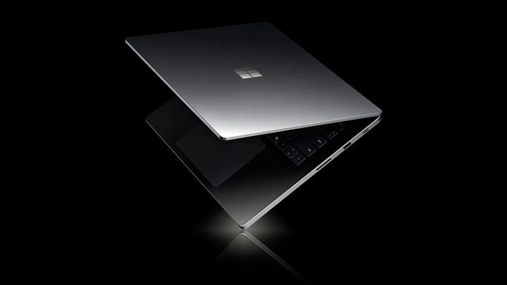 Microsoft Surface Laptop Ultra laptop half-open on a black background