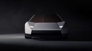 White angular 2026 Tesla Roadster sports car in a dark studio, front three-quarter view