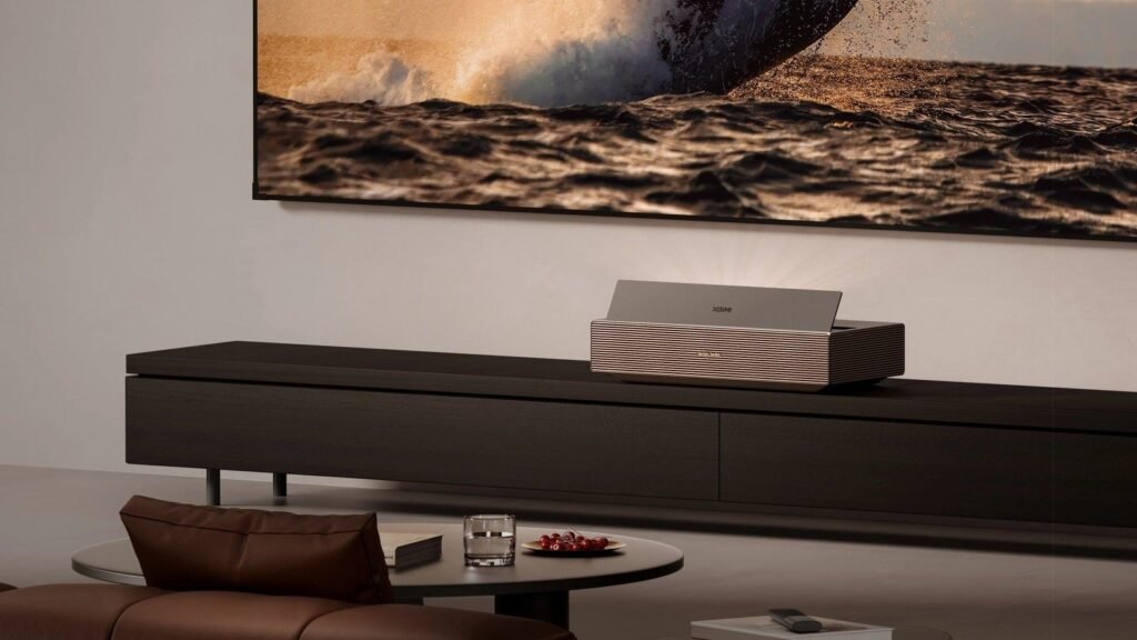 XGIMI AURA 3 Max projector casting a huge ocean scene onto a living room wall